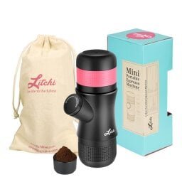 black espresso maker with red circular top, carrying bag to the left, product box to the right