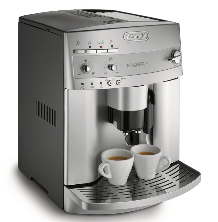 steel-colored espresso machine with two small espresso cups in beige facing slight right